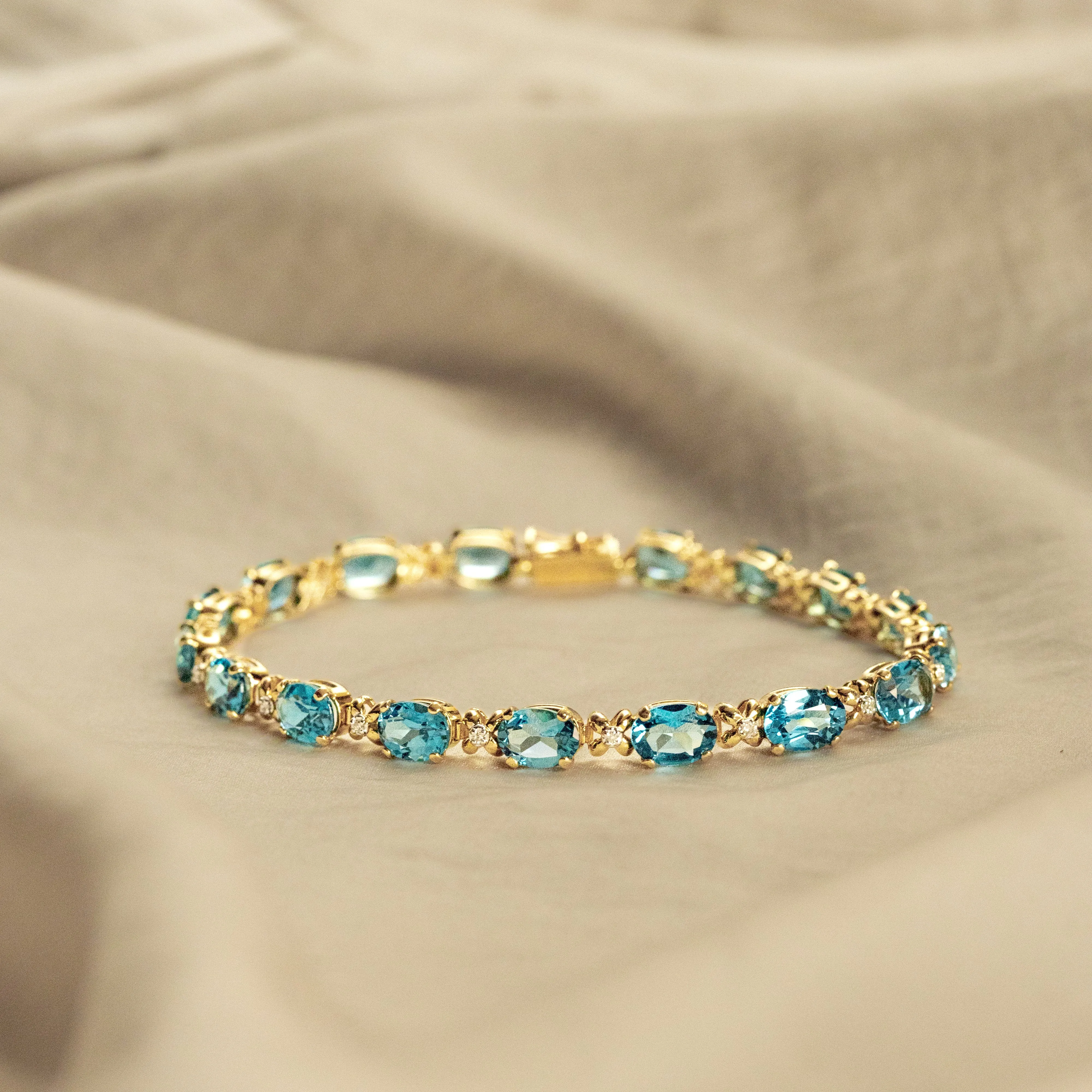 14K Yellow Gold Oval Blue Topaz Diamond Bracelet