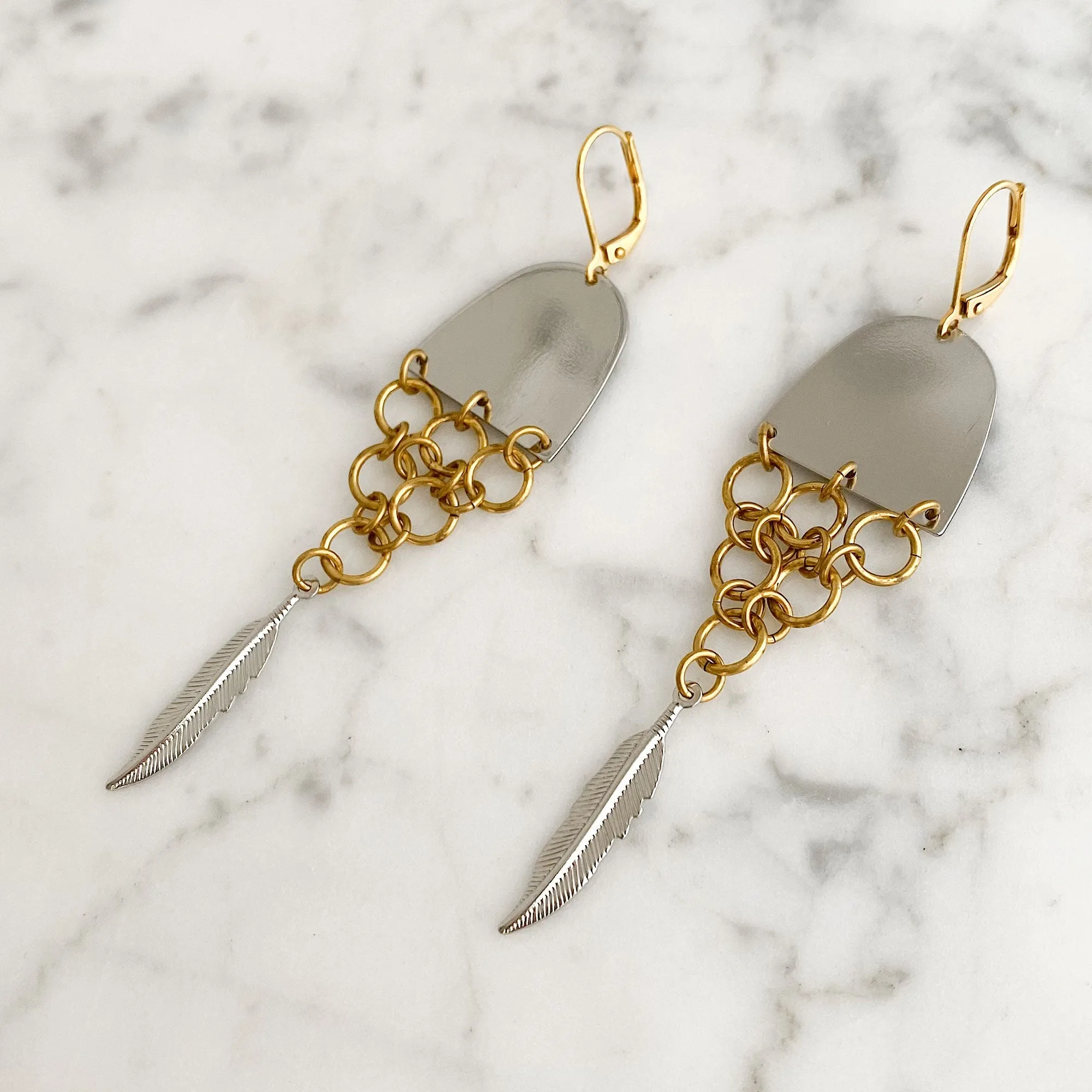 MONOHAN silver and brass fishtail earrings